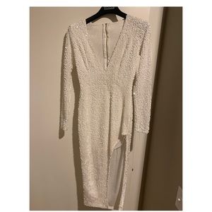 White sequin dress. Deep slit